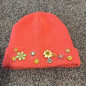 Coral colored beanie with flowered gems